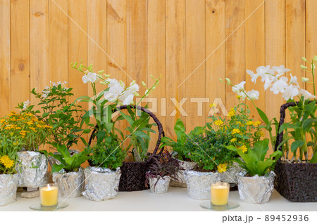 flowers decorate on the dinning long table in the luxury relax event with the wood plate background. 89452936