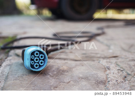 Closeup view at Electric car charging plug Closeup view at Electric car charging plug 89453948