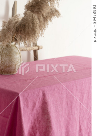 Home decor concept, table with pink tablecloth 89453993
