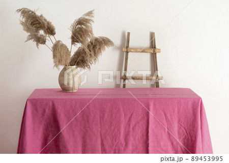 Home decor concept, table with pink tablecloth Home decor concept, table with pink tablecloth 89453995