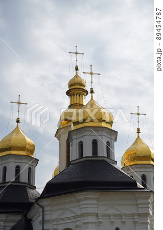 Gilded domes of an ancient Orthodox church against the sky. Catherine's Church is a functioning church in Chernihiv, Ukraine. St. Catherine's Church was built in the Baroque style. Gilded domes of an ancient Orthodox church against the sky. Catherine's Church is a functioning church in Chernihiv, Ukraine. St. Catherine's Church was built in the Baroque style. 89454787