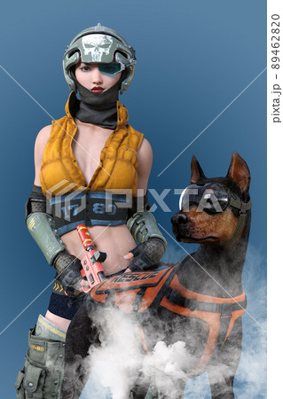 黄色いジャケットにドクロヘルメットをかぶった女性と、ゴーグルと装備を身につけた屈強なドーベルマン。 89462820