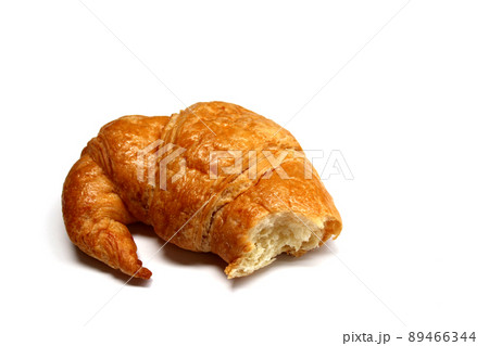 The bitten croissant isolated on the white background The bitten croissant isolated on the white background 89466344