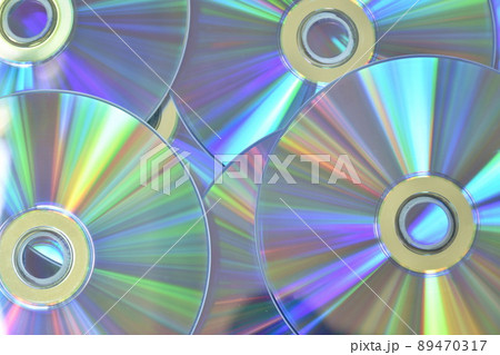 CD or DVD with colorful light reflection on surface in white background 89470317
