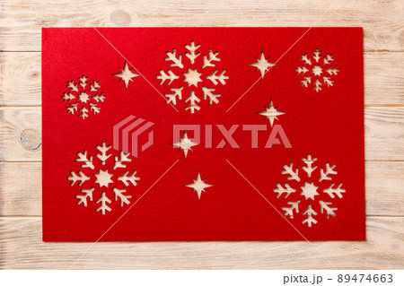 Top view of red tablecloth for food on wooden background. Empty space for your design 89474663