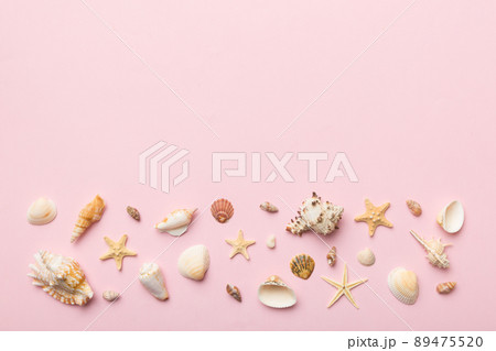 Summer time concept Flat lay composition with beautiful starfish and sea shells on colored table, top view with copy space for text Summer time concept Flat lay composition with beautiful starfish and sea shells on colored table, top view with copy space for text 89475520