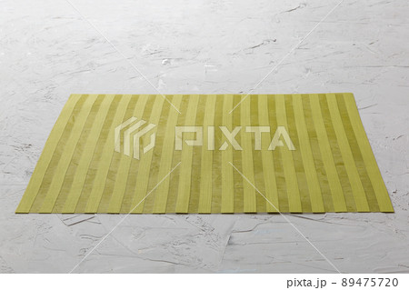 Perspective view of green tablecloth for food on cement background. Empty space for your design Perspective view of green tablecloth for food on cement background. Empty space for your design 89475720