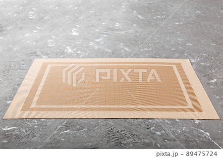 Perspective view of brown tablecloth for food on cement background. Empty space for your design Perspective view of brown tablecloth for food on cement background. Empty space for your design 89475724