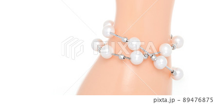 Double strand freshwater pearl bracelet on jewelry display stand. Collection of luxury jewelry accessories. Studio shot 89476875