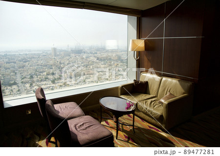 DUBAI, UNITED ARAB EMIRATES - JUN 16, 2019: Empty chairs in a business hotel lounge in an upper floor DUBAI, UNITED ARAB EMIRATES - JUN 16, 2019: Empty chairs in a business hotel lounge in an upper floor 89477281
