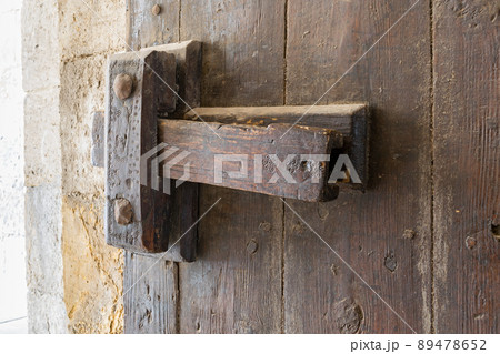 Closeup of a wooden aged latch 89478652