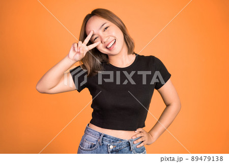 woman with peaceful hand gesture on isolated background woman with peaceful hand gesture on isolated background 89479138