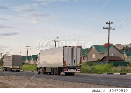 white lorry with white trailer on the asphalt road white lorry with white trailer on the asphalt road 89479910
