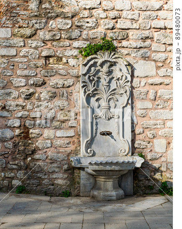 Marble sculpted drinking fountain at Gulhane Park, Sultan Ahmet district, Istanbul 89480073