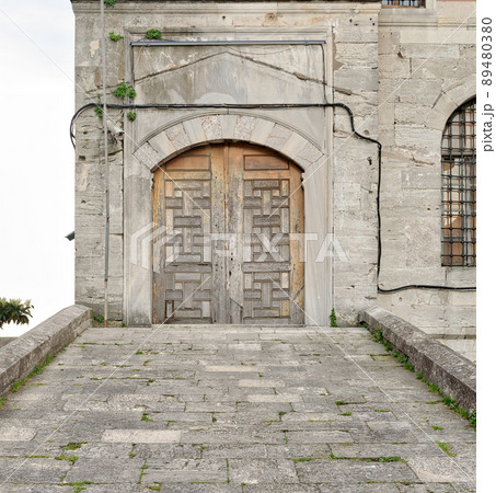 Stone tiled ramp leading to a wooden aged door over a stone wall, Sultan Ahmed Mosque (Blue Mosque), Istanbul, Turkey Stone tiled ramp leading to a wooden aged door over a stone wall, Sultan Ahmed Mosque (Blue Mosque), Istanbul, Turkey 89480380