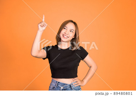 woman with finger pointing up hand gesture on isolated background 89480801
