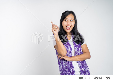 woman with finger pointing up hand gesture on isolated background 89481199