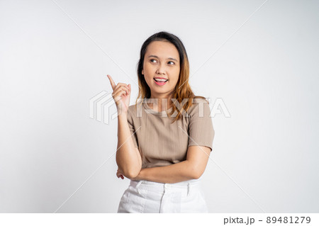 woman with finger pointing up hand gesture on isolated background woman with finger pointing up hand gesture on isolated background 89481279