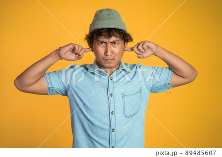 man cover his ear does not want to hear anything man cover his ear does not want to hear anything 89485607