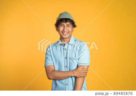 asian man stand with crossed hands on isolated asian man stand with crossed hands on isolated 89485870
