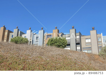 Complex box houses with chimneys on top of a slope in San Francisco, California Complex box houses with chimneys on top of a slope in San Francisco, California 89486753