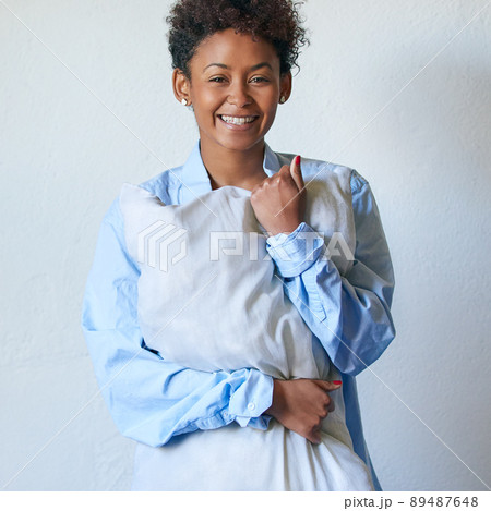 I love my sleep. Studio portrait of an attractive young woman holding a pillow against a white background. 89487648