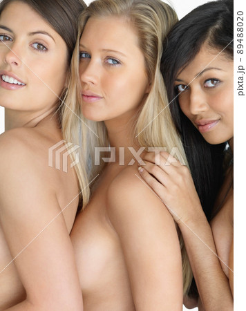 The bare threesome. Happy topless females standing together posing. The bare threesome. Happy topless females standing together posing. 89488020