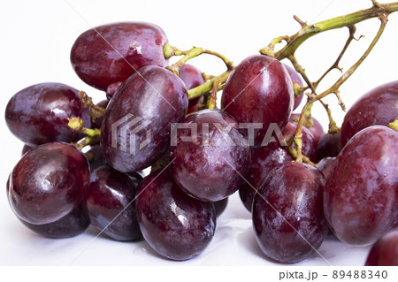 Bunch of red grapes on white background Bunch of red grapes on white background 89488340