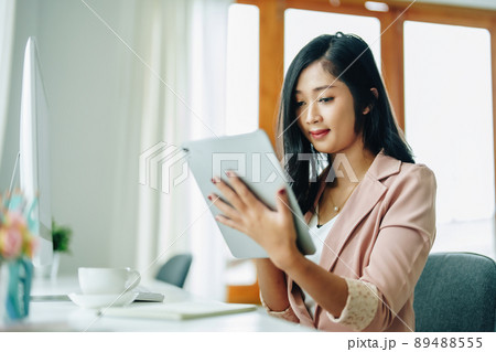 data analysis, plan, marketing, accounting, audit, Portrait of asian business woman planning marketing using tablet and computer to present marketing plan project at meeting 89488555