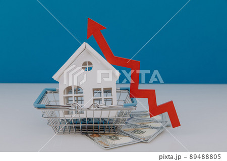 House model in a basket and red arrow up. The concept of inflation, economic growth, the price of insurance services House model in a basket and red arrow up. The concept of inflation, economic growth, the price of insurance services 89488805
