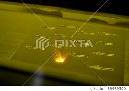 3D printer prints object from metal powder. Metal is sintered under laser into 3D shape in working chamber. Laser sintering machine for metal. Robotics work. Additive manufacturing metal 3D printer 89489500