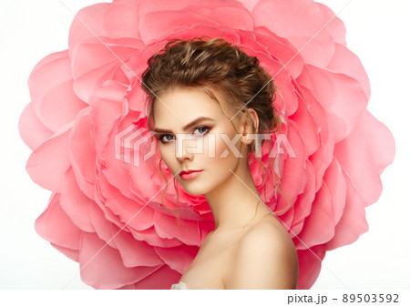 Beautiful woman on the background of a large flower 89503592
