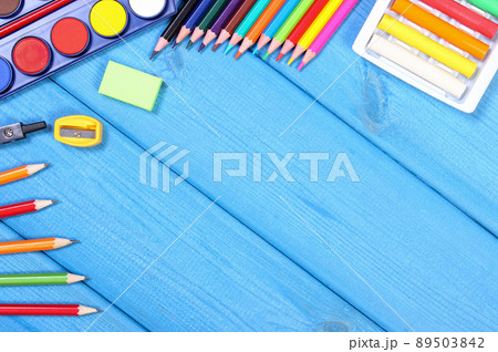 School accessories on blue boards, back to school concept, copy space for text School accessories on blue boards, back to school concept, copy space for text 89503842