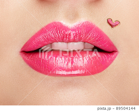 Lips painted with a lipstick heart 89504144