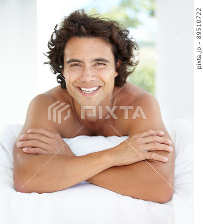 Enjoying a relaxing day at home. Portrait of a handsome young man relaxing at home. Enjoying a relaxing day at home. Portrait of a handsome young man relaxing at home. 89510722