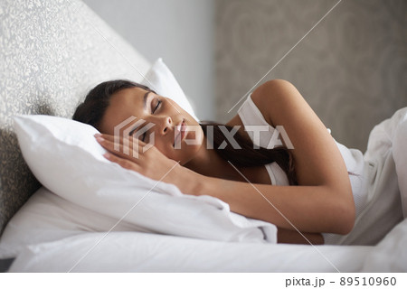 Sweet dreams in process. A beautiful young woman sleeping in her bed. 89510960