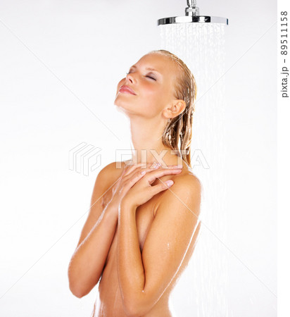 This water pressure is perfect. Cute young woman loving the water on her head as she has a shower - Copyspace. This water pressure is perfect. Cute young woman loving the water on her head as she has a shower - Copyspace. 89511158
