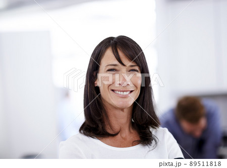 She always delivers top-quality work. Portrait of an attractive businesswoman standing in an office environment. She always delivers top-quality work. Portrait of an attractive businesswoman standing in an office environment. 89511818
