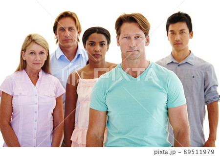 Taking a stand for unity. Five adults of varying ages and ethnicities standing in a group with serious expressions. 89511979