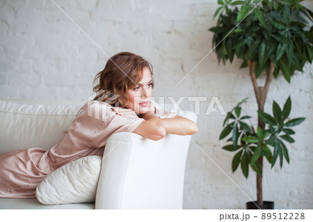 Beauty woman dreaming and relaxing at home Beauty woman dreaming and relaxing at home 89512228