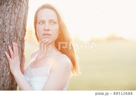 Beautifully natural. Cropped shot of an attractive woman posing outside. 89512688