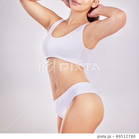 Make sure that you treat your body with love and respect all year round. Cropped shot of a fit young woman posing in her underwear. 89512780