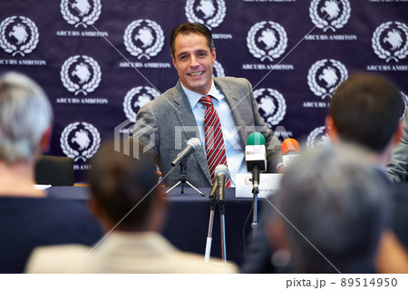 Easing their concerns. Shot of a group of businesspeople in a press conference. 89514950