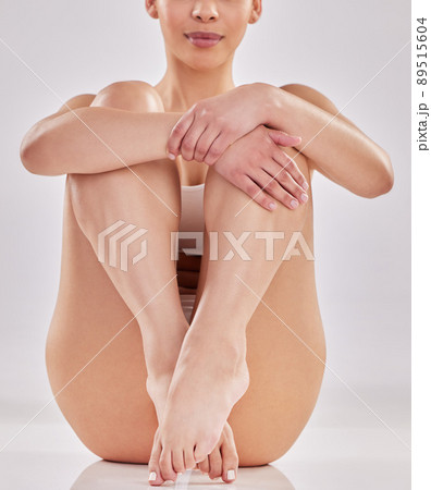 My body is everything it should be. Shot of a young woman sitting against a studio background. 89515604