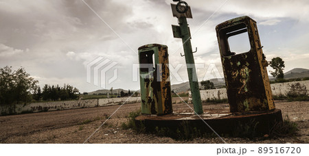 Old abandoned rusty gas station destroyed, gloomy sky copy space Old abandoned rusty gas station destroyed, gloomy sky copy space 89516720