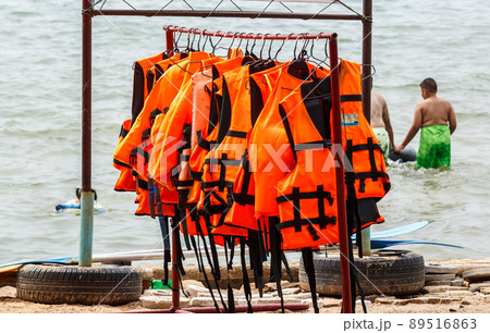 Life jacket hanging near the sea. Life jacket hanging near the sea. 89516863