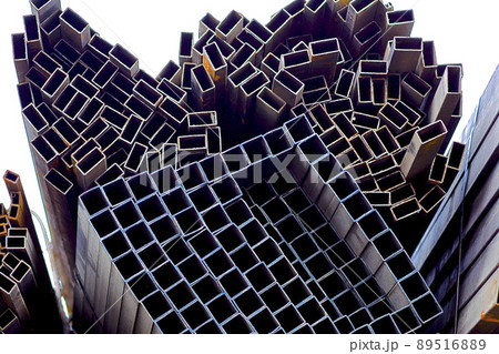 Metal profile pipe of rectangular cross section in packs at the warehouse of metal products Metal profile pipe of rectangular cross section in packs at the warehouse of metal products 89516889