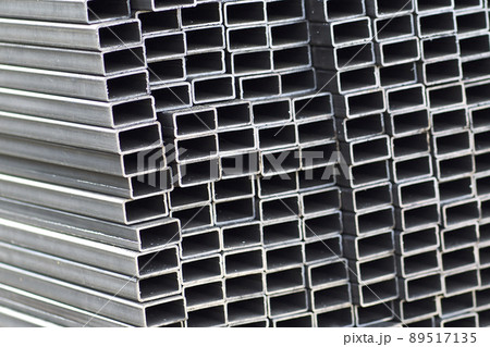 Metal profile pipe of rectangular cross section in packs at the warehouse of metal products Metal profile pipe of rectangular cross section in packs at the warehouse of metal products 89517135