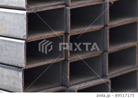 Metal profile pipe of rectangular cross section in packs at the warehouse of metal products Metal profile pipe of rectangular cross section in packs at the warehouse of metal products 89517175