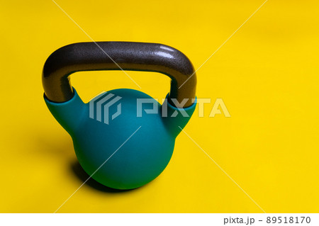 For Kettlebell yellow background Blue with space on a text space iron, for cast lifting in equipment from heavy lifestyle, kettle simple. Vivid pound shape, medical retro athletic strong 89518170